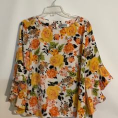 Kasper 100% Polyester Top - Blouse - Shirt White Background Floral Design Size Petite Extra Large (Pxl) Petite Plus Size New Without Tags The Flower Details Are Tangerine, Yellow, Peach, Black, Tan And Green. Set In Bell Sleeves - 3/4 Length- Ruffle Cuff Boat Neckline With Keyhole Back One Button Closure Measurements- Front Armpit To Armpit - 24” Back Armpit To Armpit- 24” Length - 25” Sleeve Length - 16” This Top Can Be Worn To Dress Up Or Dress Down. Pair With Jeans, Dress Pants, Trousers, Ski Spring Orange Printed Tops, Orange Floral Print Shirt For Spring, Orange Printed Tops For Spring, Orange Spring Vacation Shirt, Trendy Printed Yellow Blouse, Trendy Yellow Printed Blouse, Orange Vacation Shirt For Spring, Spring Vacation Orange Shirt, Orange Shirt For Spring Vacation