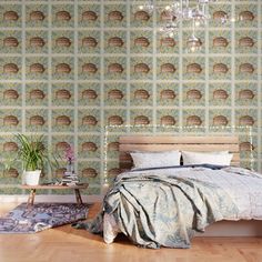 a bedroom with a bed and chandelier hanging from the ceiling next to a wooden floor