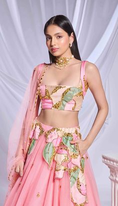 Our pink tulle lehenga is adorned with intricate patchwork embroidery and metallic accents cascading from the waist to the hips. The lehenga is embellished with scatter embroidery, featuring gold elements and delicate pink crystals throughout. Completing the ensemble is a sleeveless pink blouse featuring matching patchwork.From Papa Don’t Preach’s Bring Your Own Fairytale collection. DELIVERY TIMEPlease allow 8-12 weeks for your outfit to arrive. FABRIC DETAILSTulle Professional cleaning only. Tulle Lehenga, Patchwork Embroidery, Pink Lehenga, Pink Tulle, Indian Outfit, 12 Weeks, India Fashion, Professional Cleaning, Pink Blouse