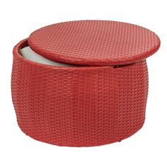 a round red wicker box with lid on white background, close up view from the front