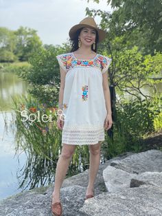 This Adorable Babydoll Dress is the perfect addition to your wardrobe. It's made out of fresh cotton or manta (as its called in Spanish) and it is hand embroidered with cotton string. The design is unique with lace details throughout and the colorful embroidery reflects the Rich Mexican culture! Note: Shoes and Jewelry modeled may be purchased here: Shoes: https://www.etsy.com/es/listing/828873953/zapato-artesanal-de-plataforma-zapato?ref=listings_manager_grid Filigrana Earrings: https://www.ets Short Sleeve Cotton Dress With Geometric Embroidery, Cotton Dresses With Geometric Embroidery And Short Sleeves, Spring Cotton Dress With Geometric Embroidery, Casual Cotton Dresses With Geometric Embroidery, Spring Cotton Embroidered Dress With Machine Embroidery, Casual Cotton Dress With Geometric Embroidery, Cotton Embroidered Dress With Machine Embroidery For Spring, Fitted Cotton Dress With Geometric Embroidery, Bohemian Summer Embroidered Dress