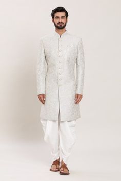 Grey full sleeves malai silk kurta with all over gardenia embroidery using zari and sequin highlights. Paired with a white peshawari pant. - Aza Fashions Traditional Fit Bandhgala For Eid, Elegant Art Silk Bandhgala With Chikankari Embroidery, Eid Traditional Bandhgala, Traditional Bandhgala With Chikankari Embroidery In Art Silk, Elegant Bandhgala With Chikankari Embroidery For Navratri, Traditional Fit Bandhgala For Wedding, Eid Bandhgala With Cutdana In Traditional Fit, Traditional Fit Sherwani For Wedding And Diwali, Wedding Sherwani For Diwali