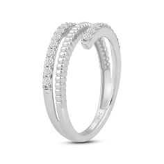 a white gold ring with two rows of diamonds on the sides and an open band