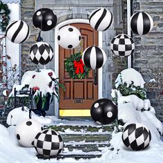 black and white christmas decorations in front of a door