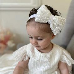 Introduce a touch of elegance and grace to your baby girl's special day with our exquisite Christening Headband. Perfectly designed to complement her Christening outfit, this headband combines delicate craftsmanship with timeless style. ☑ Why Choose This Christening Headband? *This headband is not only a beautiful accessory but also a keepsake that will capture the memory of your baby's special occasion. Crafted with care, it provides a blend of comfort and charm, making it ideal for the most me White Elegant Baptism Dress For First Birthday, Elegant White Baptism Dress For First Birthday, White Adjustable Hair Accessories, White Matching Headband For Baptism, White Baptism Dress With Bow, White Hair Accessories With Matching Headband For Baptism, Elegant White Baptism Dress With Bow, Cream Baptism Headband Hair Accessory, Adjustable Bow Headband For Weddings