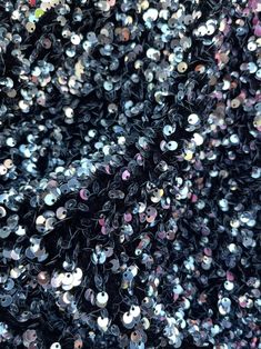 many different types of sequins are scattered together