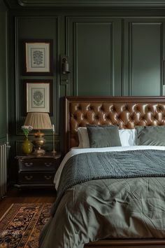 a bedroom with green walls and leather headboard