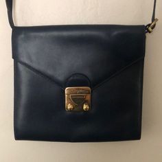 Belonged To A Family Friend. This Navy Blue Ferragamo Purse Is Timeless. It’s Envelope Style With A Cross Body Strap. Perfect For Dressing Up And Dressing Down. Minor Leather Scratches That Come With A Piece Held For So Many Years. Blue Saffiano Leather Bags With Gold-tone Hardware, Blue Shoulder Bag With Leather Handles For On-the-go, Vintage Ferragamo Bag, Salvatore Ferragamo Sofia Bag, Salvatore Ferragamo Bags, Dressed Down, Friends Family, Continental Wallet, Salvatore Ferragamo