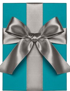 a blue gift box with silver ribbon and bow