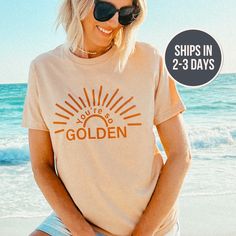 You're So Golden ------ + unisex fit + printed with ink on a tan color tee + made in our ohio studio + 52/48 cotton/polyester Sunshine Shirt, You're So Golden, Tan T Shirt, Stay Golden, The Best Summer, Women Travel, Travel Beach, Instagram Life, Retro Shirts