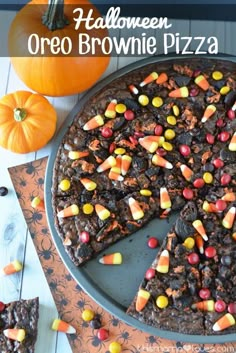 a halloween oreo brownie pizza with candy corn and chocolate chips on the side