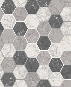 an abstract tile design with hexagons in grey and white