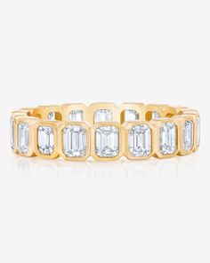 Platinum or 14k solid gold Diamonds: Color: G/H Clarity: VS Classic: Width: 4.2 mm Carat weight per stone: approximately 0.15 each Eternity diamond coverage: Total carat weight: 2.4-3 cttw (ranges depending on finger size) Size 6: 18 diamonds at 2.70 cttw 3/4 diamond coverage: Total carat weight: 1.80-2.25 cttw (ranges depending on finger size) Size 6: 15 diamonds at 2.25 cttw Eternity bands cannot be resized and 3/4 diamond coverage can only be resized 1/4-1/2 size. We recommend ordering this s Yellow Gold Moissanite Eternity Band With Diamond Cut, Luxury Yellow Gold Eternity Band With Bezel Setting, Luxury Gold Eternity Band With Bezel Setting, Gold Cubic Zirconia Eternity Band With Bezel Setting, Yellow Gold Diamond Eternity Band With Baguette Cut, Yellow Gold Cubic Zirconia Baguette Cut Eternity Band, Yellow Gold Emerald Cut Diamond Eternity Band, Fine Jewelry Diamond Eternity Band With Bezel Setting, Gold Diamond Eternity Band With Baguette Cut