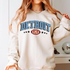 Step up your game day style with this vintage Lions sweatshirt. Perfect for Detroit football fans, this retro 80s-inspired shirt is an ideal Lions Football Fans or Super Bowl gear. Show off your Lions pride! Hello there! 😊👋 If you're on the hunt for some seriously cozy sweatshirts, you've come to the right place! I'm absolutely passionate about what I do, and my mission is to make your shopping experience absolutely perfect. If you ever have any questions, concerns, or just want to chat about Throwback Letter Print Sweatshirt For Fall, College Throwback Style Sweatshirt With Screen Print, Vintage Cotton Sweatshirt For Game Day, Fall Throwback T-shirt With Letter Print, Fall Throwback Letter Print T-shirt, Retro Sweatshirt For Game Day, Sports Season, Retro Sweatshirt For Game Day And Sports Season, Retro Game Day Tops For Fall, Retro Sweatshirt For Game Day