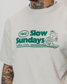 100% soft cotton jersey Mid-weight 220 GSM Hand-drawn graphic Screen-printed Short sleeves[shortcode] [description]The Slow Sunday’s Vol. 2 T-shirt in bone white is a relaxed fit men’s t-shirt made from a mid-weight 100% soft cotton jersey. This classic crewneck features a nostalgic screen-printed front graphic, inspired by our best-selling Slow Sunday’s T-shirt. Part of the Slow Sundays Coffee Club collection.[/description] [fit] Relaxed Fit Delph is 5'11" and wears a size small [/fit][/shortcode] Slow Sundays Coffee Club, Mens White Graphic Tee, Graphic Tee For Men, Hoodie Design Graphic, Screen Printed Tshirt, Retro Graphic Tshirt, Shirt Print Design Graphic Tees, White Tshirt Design, Graphic Tees Design Prints