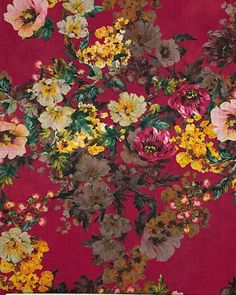 a red background with flowers and leaves on the bottom right corner is an image of many different colored flowers