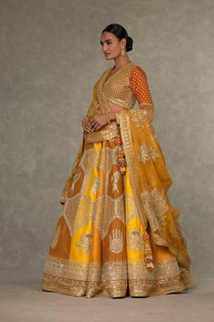 House Of Masaba | Ochre Neel Kamal Lehenga Set | INDIASPOPUP.COM Mustard Yellow Color Combinations, Can Can Skirt, Dupatta Draping, Bridal Pose, Best Indian Wedding Dresses, Draping Styles, Heavy Lehenga