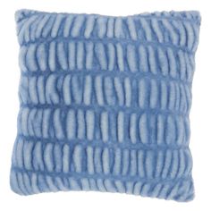 a blue and white pillow that is made from faux fur, on a white background