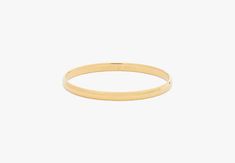 Heart Of Gold Idiom Bangle | Kate Spade New York Classic Gold Bangle For Everyday, Classic Kate Spade Jewelry For Anniversary, Kate Spade Classic Jewelry For Anniversary, Gold Metal Bangle For Anniversary, Kate Spade Gold Jewelry For Formal Occasions, Everyday Metal Bangle, Everyday Gold Metal Bangle, Classic Brass Bangle Bracelets, Formal Gold Jewelry By Kate Spade