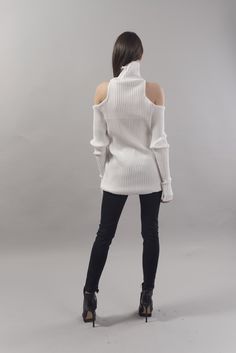 "High polo neck and open shoulders, this sweater dress has long panels outlining the asymmetric fluted hem. It is crafted from luxury wool acrylic blend. Cut for an oversized fit, with dropped shoulders, which creates a relaxed look and comfort. MATERIALS: cotton acryl blend -------------------------------------- If you have any questions about the item or have any personal requirements about the garment, please do not hesitate to send us a message, our team is available 24/7, or check out our s Fall Winter White Sweater Dress, Winter White Sweater Dress For Fall, Winter White Stretch Sweater, White Stretch Sweater Dress For Fall, Winter White Sweater Dress For Winter, Winter Turtleneck Stretch Sweater Dress, Stretch Sweater Dress For Winter, Stretch Turtleneck Sweater Dress For Winter, White Ribbed Sweater Dress For Winter