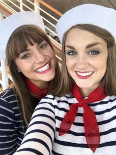 two women in sailor hats taking a selfie