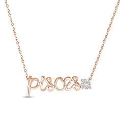 a rose gold plated necklace with the word piscs and a diamond on it