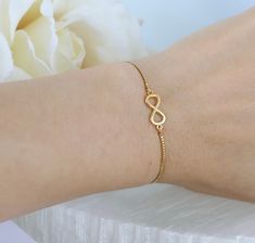 18k gold plated adjustable infinity bracelet, simple gold infinity link connector connected to adjustable high quality long lasting chain, the size of the connector is 14mm long and 6mm wide. simple elegant bracelet makes it a great piece of jewelry for everyday wear & makes a great gift for someone special. Minimalist Infinity Bracelet With Adjustable Chain, Minimalist Infinity Bracelets For Anniversary, Minimalist Infinity Bracelet For Anniversary, Dainty Infinity Bracelets With Adjustable Chain, Dainty Infinity Bracelet With Adjustable Chain, Minimalist Infinity Bracelets As Gift, Minimalist Infinity Bracelet As A Gift, Minimalist Infinity Bracelets For Gifts, Minimalist Infinity Bracelet For Gift