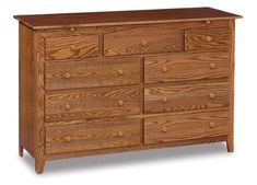 a wooden dresser with many drawers and knobs on the top drawer, against a white background