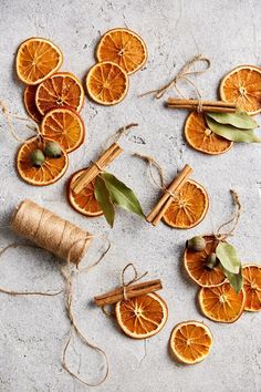 orange slices and cinnamon sticks tied to twine