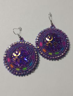 Hand-made beaded earrings: Colors: Purple w/neon colors  Closure: Hook size: 2 inches Nickel-free Purple Beaded Round Earrings, Handmade Multicolor Beaded Earrings For Party, Unique Multicolor Beaded Earrings For Party, Handmade Party Earrings With Round Beads, Handmade Purple Beaded Earrings, Handmade Multicolor Beaded Earrings For Festive Occasion, Purple Colorful Beaded Earrings For Festival, Festival Purple Beaded Earrings, Purple Beaded Earrings With Colorful Beads