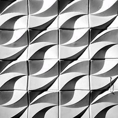 black and white photograph of wavy lines on a wall