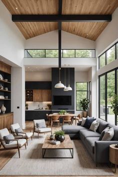 a living room filled with furniture and lots of windows