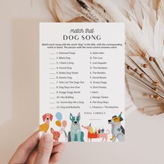 a person holding up a printable dog song