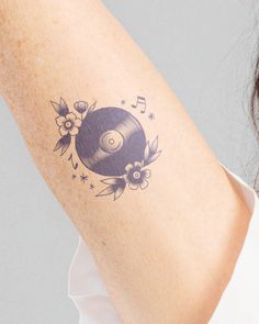 a woman with a tattoo on her arm