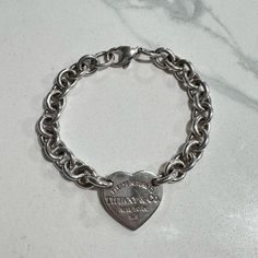 Return To Tiffany Collection Sterling Silver Charm Bracelet With Heart Tag. In Good Condition With Surface Scratches. Does Not Come With Bag Or Box. Jewelry Tiffany, Bracelet With Heart, Return To Tiffany, Sterling Silver Charm Bracelet, Heart Tag, Tiffany Co Jewelry, Silver Charm Bracelet, Sterling Silver Charm, Tiffany & Co.