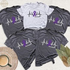 Memories Matter Alzheimer's Custom Shirt, Purple Ribbon Awareness Team Tshirt, Memories Matter Group Shirts, I Will Remember For You Outfit. Designed to raise awareness of Alzheimer's disease and support those living with the disease. These t-shirts usually aim to raise awareness and provide social support in the fight against the disease. They usually have slogans such as "Memories Matter" or symbols related to Alzheimer's. These types of products are used to both boost the morale of those stru Purple Casual Top For Awareness Events, Casual Purple Top For Awareness Events, Purple T-shirt For Awareness Events With Letter Print, Purple T-shirt With Letter Print For Awareness Events, Crew Neck Top With Graphic Print For Awareness Events, Graphic Print Crew Neck Top For Awareness Events, Purple Ribbon Awareness, Team Tshirt, Awareness Tshirts