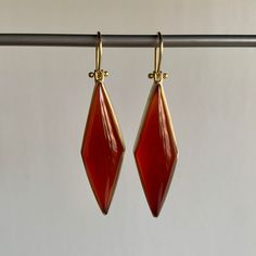 Rich vermillion color balances elegance with extravagance in these strikingly structured carnelians. 18k yellow gold Carnelian, 31.8ctw, 11mm x 38mm (7/16" x 1 1/2")Earrings hang 2 1/16" from the ear Each earring weighs 5.3g Pierced Carnelian Drop Earrings, Carnelian Drop Earrings, Vermillion Color, Elegant Orange Carnelian Earrings, Orange Carnelian Earrings, Kite Earrings, Nickel-free Red Carnelian Earrings, 2 Earrings, Newport Ri