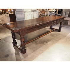 an old wooden table in a shop