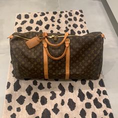 Louis Vuitton Keepall Monogram Lv Luggage Duffel Bag Size 50 Made In France Date Code: Fl0052 Circa 2002 Comes With Everything Seen! Great Condition! Comes With: *Lv Luggage Tag & *Lv Lock & Key Guaranteed Authentic! Free Shipping! Designer Brown Travel Bag With Large Capacity, Rectangular Brown Luggage For Shopping, Luxury Brown Luggage With Dust Bag Included, Brown Leather Trim Bag For Everyday Luxury, Designer Brown Luggage With Leather Trim, Designer Monogram Canvas Travel Bag With Luggage Sleeve, Brown Monogram Canvas Travel Bag With Leather Trim, Brown Monogram Canvas Luggage For Travel, Monogram Canvas Travel Bag