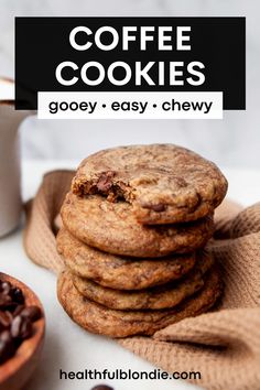 chocolate chip cookies stacked on top of each other next to a bowl of coffee beans