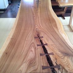 a wooden table that has been made to look like it's being worked on