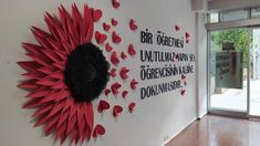 the wall is decorated with red and black paper hearts