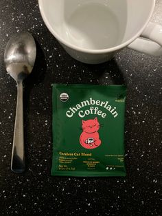 a coffee bag sitting next to a spoon