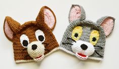 two crocheted animal hats are shown on a white surface, one is brown and the other is gray