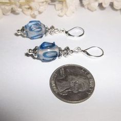 Shop Women's wvluckygirl Blue Silver Size OS Earrings at a discounted price at Poshmark. Description: This beautiful earring set is brand new & handmade by me - wvluckygirl. Done with clear slightly frosty white beads with a denim blue raised up design. They have antiqued silver toned costume jewelry beads. The pair dangle & drop from 925 sterling silver lever backs for her pierced ears. Measure 1 7/8 inches tall & 1/2 inch wide. Each single earring weighs 3.9 grams. The perfect fashion ... Nickel-free Blue Beaded Earrings For Gifts, Nickel-free Blue Beaded Earrings As Gift, Blue Hypoallergenic Beaded Earrings As Gift, Hypoallergenic Blue Beaded Earrings For Gift, Nickel Free Light Blue Beaded Earrings For Gift, Nickel-free Light Blue Beaded Earrings Gift, Everyday Hypoallergenic Silver Beaded Earrings, Blue Beaded Drop Earrings For Everyday, Blue Drop Earrings With Silver Beads