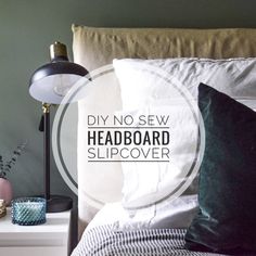 a bed with white sheets and pillows on it, next to a lamp that reads diy no sew headboard slipover