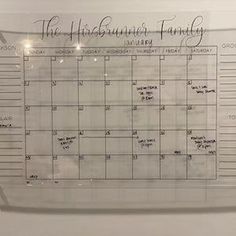 a clear glass calendar hanging on the wall