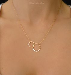 "Infinity Necklace - In Gold, Rose Gold or 100% Sterling Silver A simple and dainty infinity necklace - So simple so pretty! - 24k gold vermeil or sterling silver interlocking hoops are 27mm long - Chain is a shimmery 14k gold fill, rose gold fill or sterling silver - Total necklace length including interlocking circles is shown at 19\" ( Model has a size small neck) - Infinity has a tiny stamp of authenticity of sterling or 24k gold on one side - Necklace closes with a 14k gold fill, rose gold Simple Infinity Jewelry For Anniversary, Infinity Jewelry With Simple Design For Gift, Infinity Shaped Simple Wedding Jewelry, Rose Gold Necklaces For Best Friend Gift, Elegant Necklace For Best Friend Gift, Elegant Round Necklace For Best Friend Gift, Dainty Nickel-free Infinity Jewelry, Nickel Free Necklaces For Best Friend Gift, Elegant Adjustable Necklace For Best Friend Gift