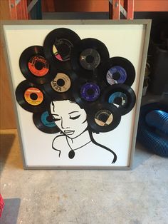 an art piece with various records on it