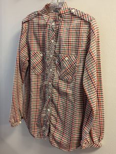 Vintage Levi's Band collar button down plaid shirt. Likely from the 1960s and seems to be cotton (no identifying tags). Definitely pre-1971. No size tag, so measurements are below. No stains, no tears. Has all its original buttons. It's in good condition.  This was found in a home on a beautiful property in Caton NY and was owned by a lovely, well travelled woman for many years. Free shipping and no handling fees :) Measurements (taken while laying flat): Chest: 20.5" Waist: 20.5" Length: 28" Fr Classic Plaid Shirt For Daywear, Classic Collared Flannel Shirt With Snap Buttons, Classic Button-up Flannel Shirt With Snap Buttons, Plaid Shirt With Spread Collar And Buttons, Plaid Collared Flannel Shirt With Button Closure, Plaid Button-up Tops, Collared Plaid Shirt With Snap Buttons, Collared Plaid Shirt With Placket, Plaid Collared Shirt With Placket